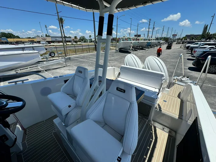  Yacht Photos Pics 2024 Windy SR28 CC boat interior with white seats and modern design.