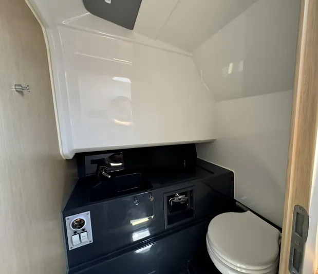  Yacht Photos Pics 2024 Windy SR28 CC boat bathroom with modern sink and toilet.