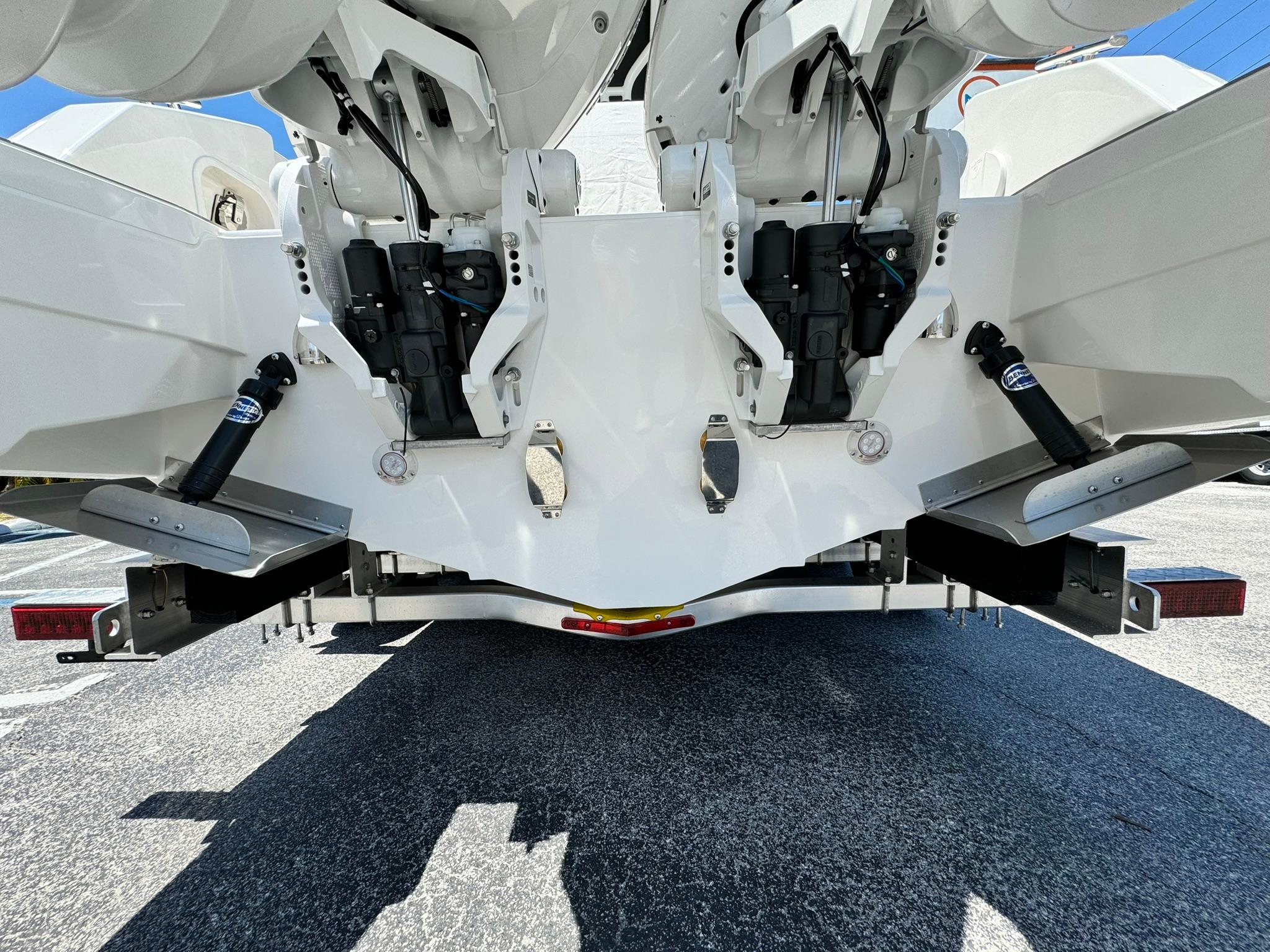 2024 Windy SR28 CC boat stern with dual outboard engines and trim tabs.