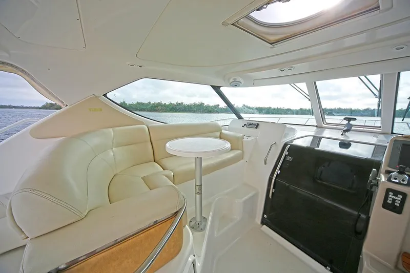 Ciao Bella Yacht Photos Pics 2007 Tiara Yachts 3900 Sovran interior with plush seating and helm view.