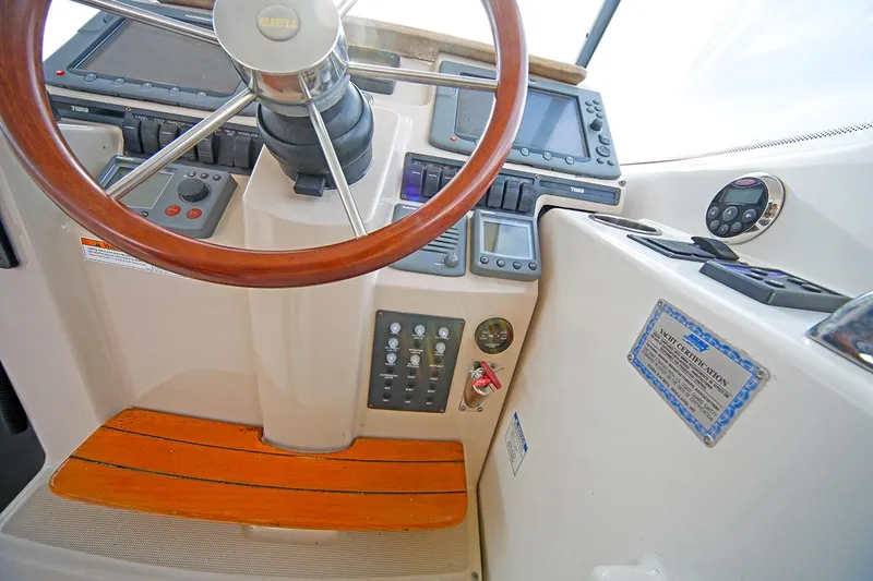 Ciao Bella Yacht Photos Pics 2007 Tiara Yachts 3900 Sovran helm with wooden steering wheel and control panel.