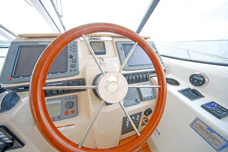 Ciao Bella Yacht Photos Pics Helm of 2007 Tiara Yachts 3900 Sovran with wooden steering wheel and navigation instruments.