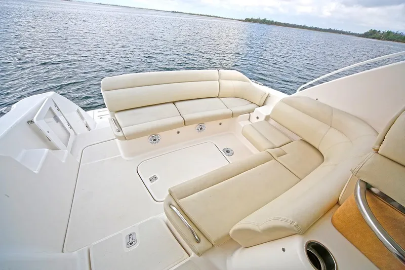 Ciao Bella Yacht Photos Pics 2007 Tiara Yachts 3900 Sovran deck with beige seating, overlooking calm waters.