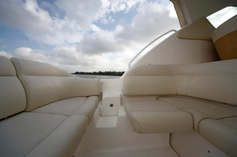 Ciao Bella Yacht Photos Pics 2007 Tiara Yachts 3900 Sovran interior with plush seating under a cloudy sky.