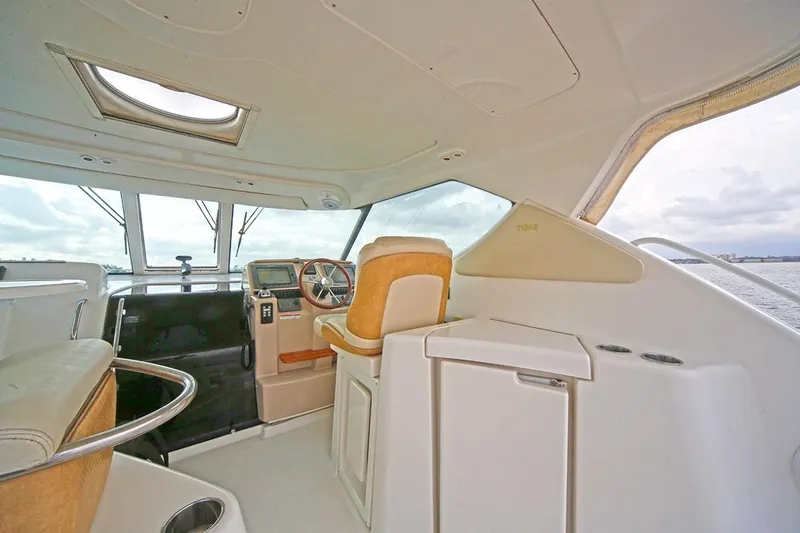 Ciao Bella Yacht Photos Pics Interior of 2007 Tiara Yachts 3900 Sovran, featuring helm and seating area.