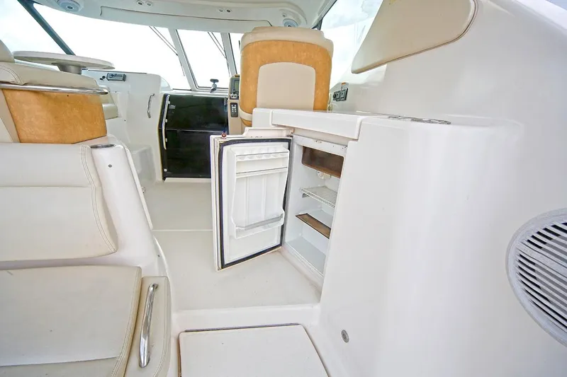 Ciao Bella Yacht Photos Pics 2007 Tiara Yachts 3900 Sovran interior with open mini fridge and seating area.