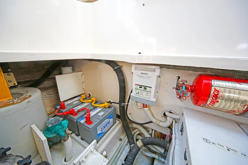 Ciao Bella Yacht Photos Pics Engine room of 2007 Tiara Yachts 3900 Sovran with battery and fire extinguisher.