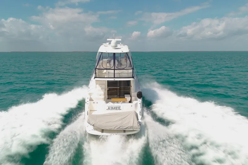 Aimee Yacht Photos Pics 2008 Sea Ray 520 Sedan Bridge cruising on open water, leaving a wake behind.