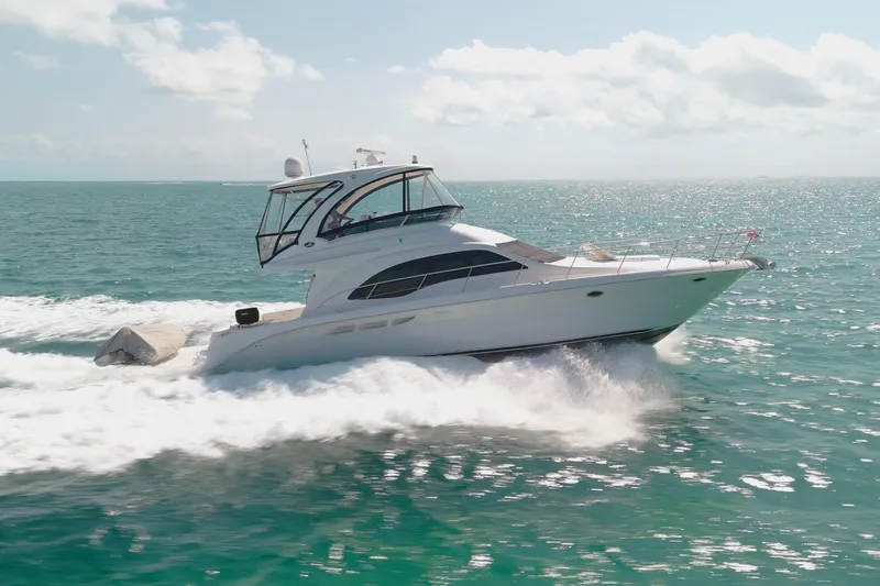 Aimee Yacht Photos Pics 2008 Sea Ray 520 Sedan Bridge yacht cruising on open water.