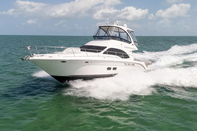 Aimee Yacht Photos Pics 2008 Sea Ray 520 Sedan Bridge yacht cruising on open water.
