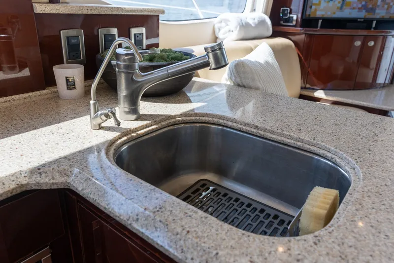 Aimee Yacht Photos Pics Luxury kitchen sink on 2008 Sea Ray 520 Sedan Bridge yacht, featuring modern fixtures.