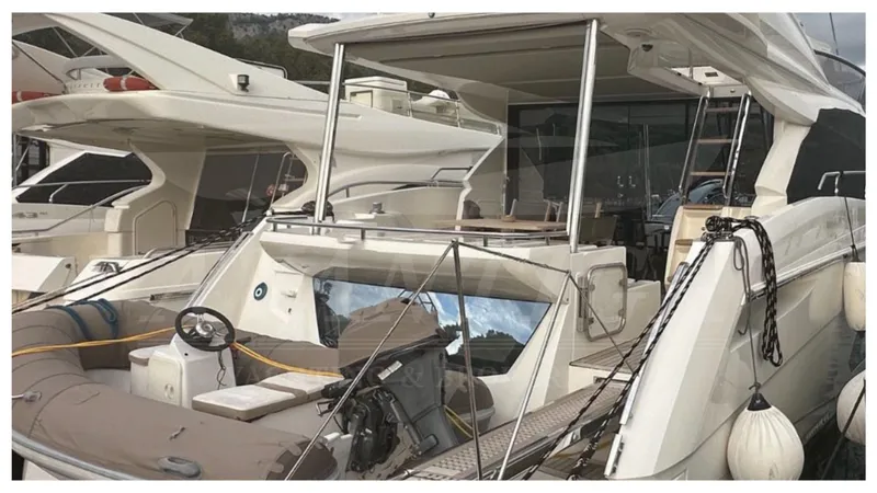  Yacht Photos Pics Luxury Absolute 52 FLY yacht, 2014 model, docked at marina with sleek design.