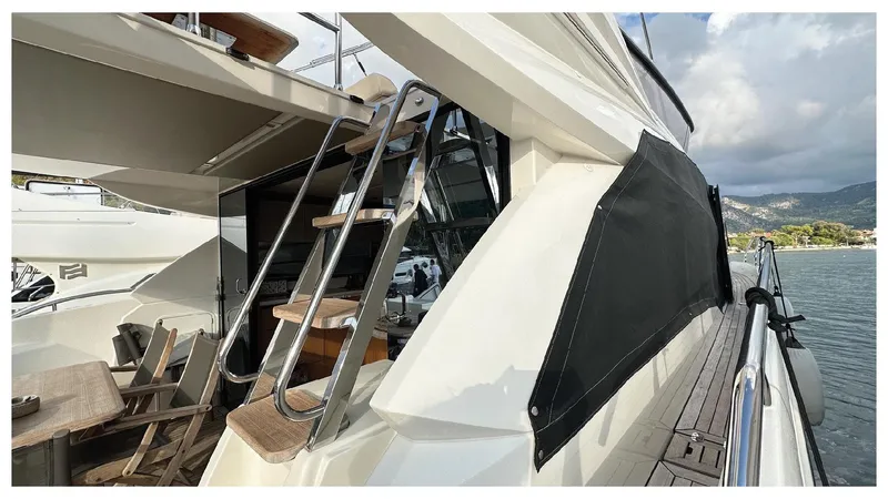  Yacht Photos Pics 2014 Absolute 52 FLY yacht with sleek design and outdoor seating area.