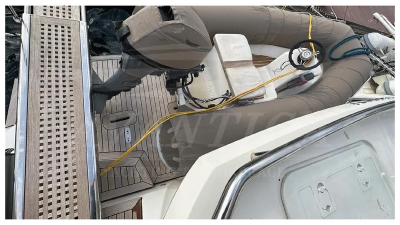  Yacht Photos Pics 2014 Absolute 52 FLY yacht deck with inflatable boat and outboard motor.