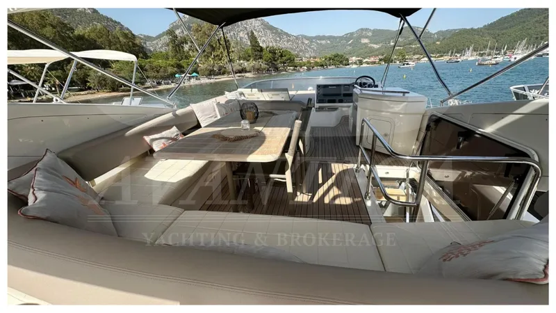  Yacht Photos Pics Luxurious 2014 Absolute 52 FLY yacht interior with dining area and scenic ocean view.