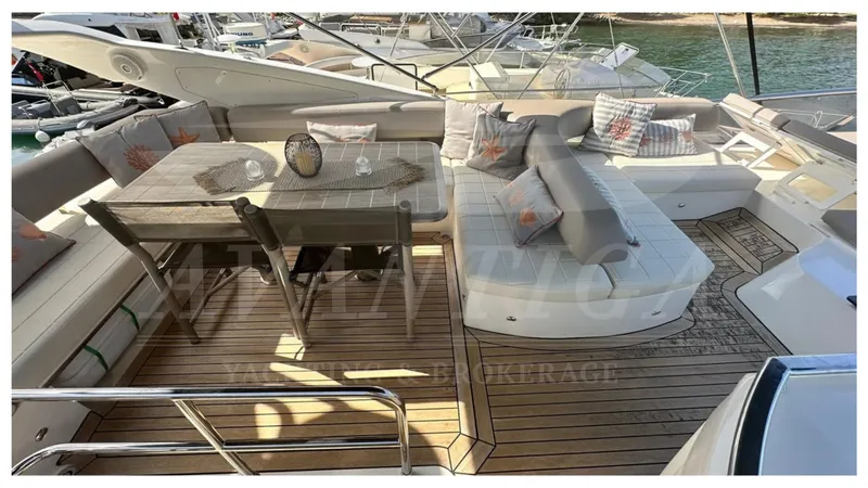  Yacht Photos Pics Luxurious 2014 Absolute 52 FLY yacht with elegant outdoor seating and dining area.