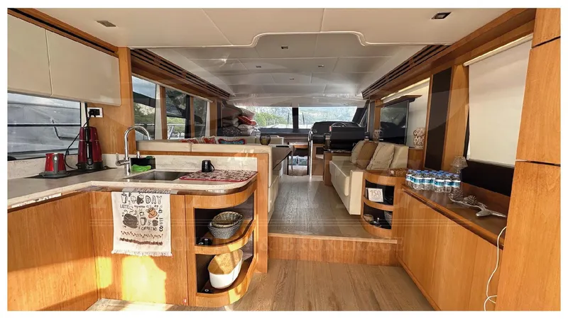  Yacht Photos Pics Luxurious interior of 2014 Absolute 52 FLY yacht with modern kitchen and seating area.