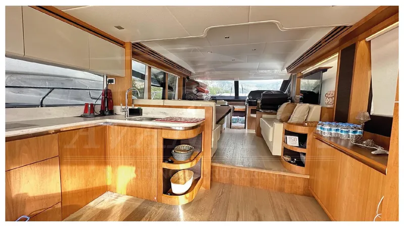  Yacht Photos Pics Luxurious interior of 2014 Absolute 52 FLY yacht with modern kitchen and seating area.