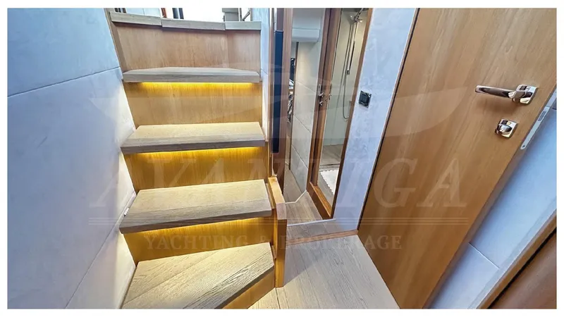  Yacht Photos Pics Staircase with ambient lighting on a 2014 Absolute 52 FLY yacht interior.