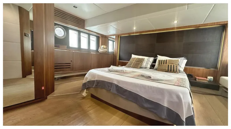  Yacht Photos Pics Luxurious bedroom interior of 2014 Absolute 52 FLY yacht with modern design elements.