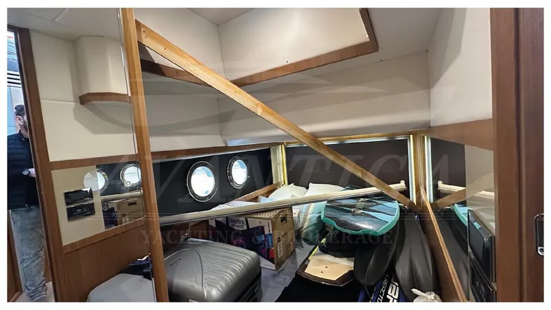  Yacht Photos Pics Interior of 2014 Absolute 52 FLY yacht with portholes and storage items.