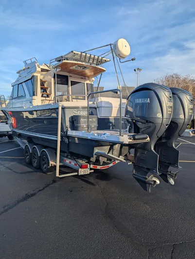  Yacht Photos Pics 2022 Cutwater C-32 CB boat with dual Yamaha engines on a trailer.