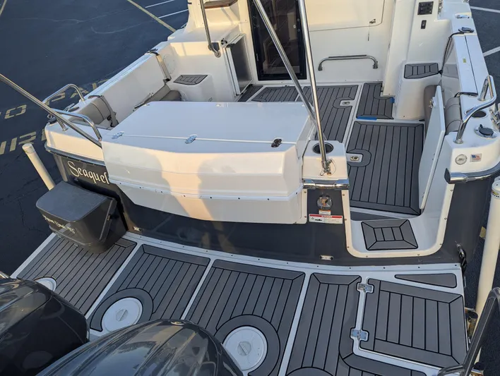  Yacht Photos Pics 2022 Cutwater C-32 CB boat deck with seating and storage compartments.