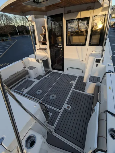  Yacht Photos Pics 2022 Cutwater C-32 CB boat deck with modern seating and sleek design.