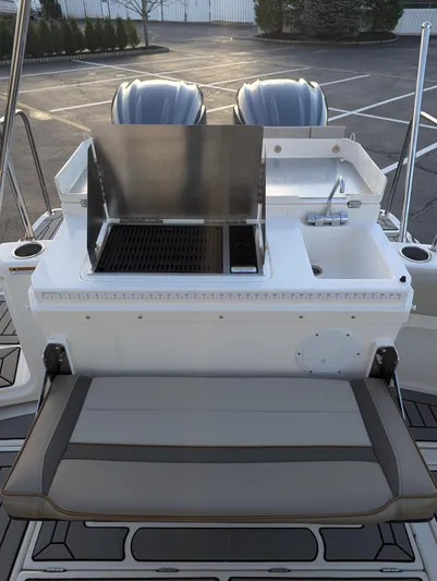  Yacht Photos Pics 2022 Cutwater C-32 CB boat with outdoor grill and seating area.