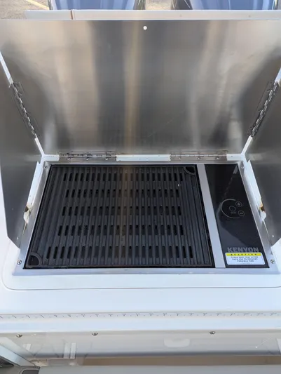  Yacht Photos Pics 2022 Cutwater C-32 CB boat grill with stainless steel cover.