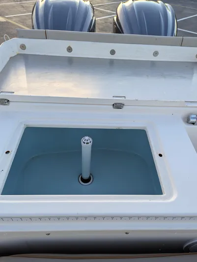  Yacht Photos Pics 2022 Cutwater C-32 CB boat livewell with dual outboard motors in background.