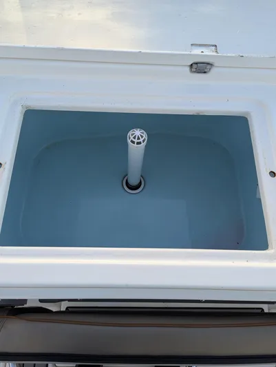  Yacht Photos Pics 2022 Cutwater C-32 CB livewell with open lid, showcasing interior design.