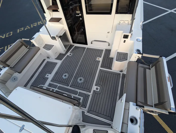  Yacht Photos Pics 2022 Cutwater C-32 CB boat deck with seating and storage compartments.