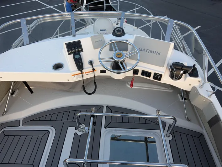  Yacht Photos Pics 2022 Cutwater C-32 CB helm with Garmin navigation and modern controls.