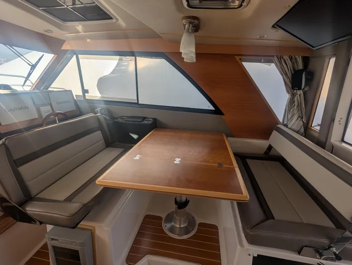  Yacht Photos Pics Interior of 2022 Cutwater C-32 CB boat with dining area and seating.