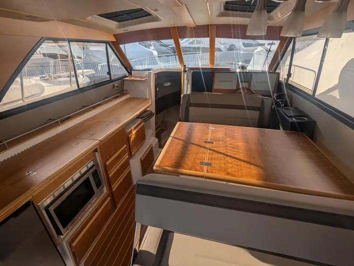  Yacht Photos Pics Interior of 2022 Cutwater C-32 CB boat, featuring modern kitchen and seating area.