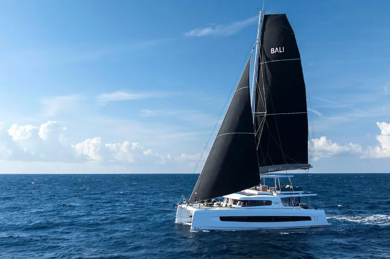 Voila Yacht Photos Pics Sailing catamaran Bali 5.2, 2026 model, cruising on open sea under clear skies.