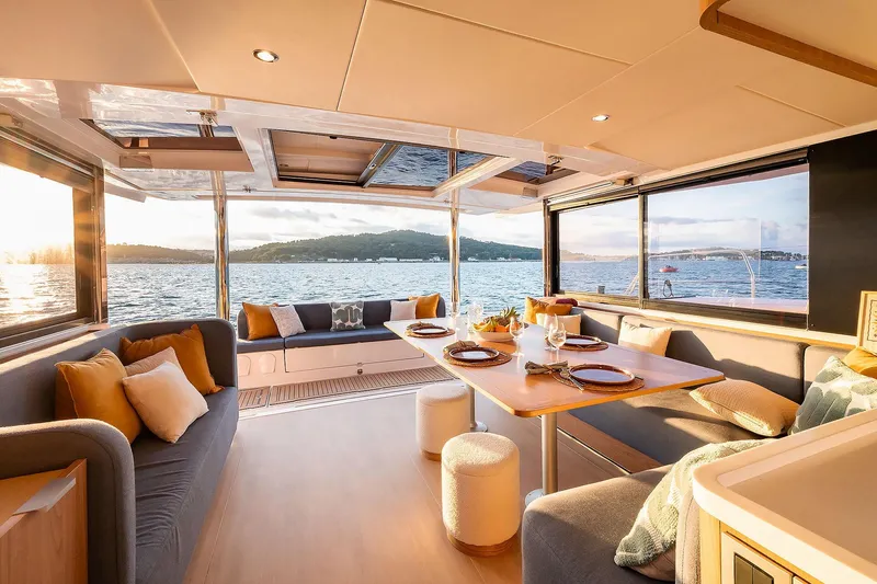 Voila Yacht Photos Pics Luxurious Bali 5.2 yacht interior with elegant dining area, scenic ocean view, and modern design.