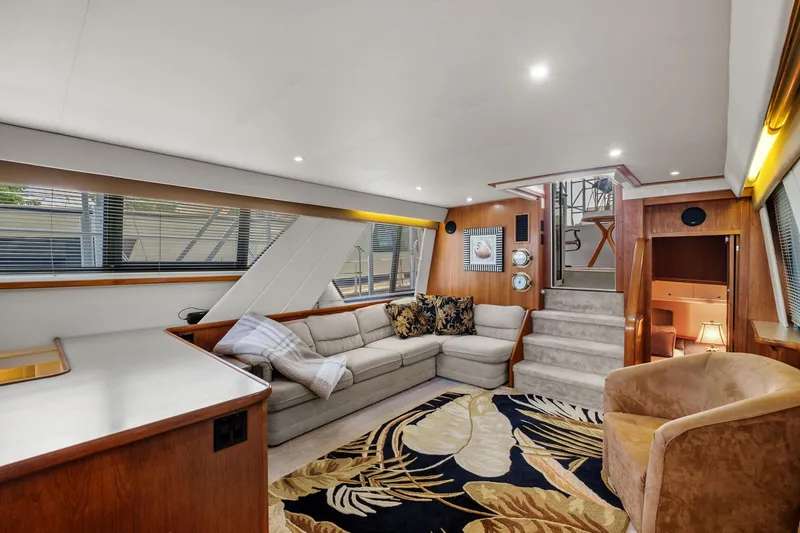 Starship Yacht Photos Pics Luxurious interior of 1996 Carver 440 Aft Cabin Motor Yacht with plush seating and elegant decor.