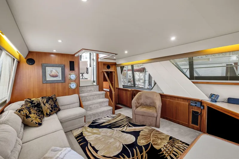 Starship Yacht Photos Pics Luxurious interior of 1996 Carver 440 Aft Cabin Motor Yacht with plush seating and elegant decor.