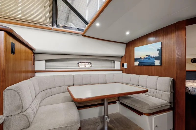 Starship Yacht Photos Pics Interior of 1996 Carver 440 Aft Cabin Motor Yacht with cozy dining area.