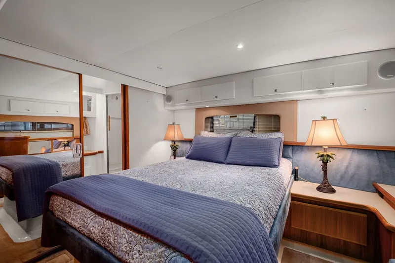 Starship Yacht Photos Pics Luxurious bedroom in 1996 Carver 440 Aft Cabin Motor Yacht with elegant decor.