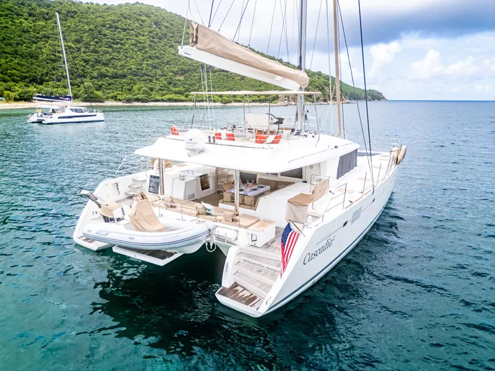 Cascadia 2 Yacht Photos Pics Luxurious 2012 Lagoon 560 catamaran anchored in serene tropical waters.
