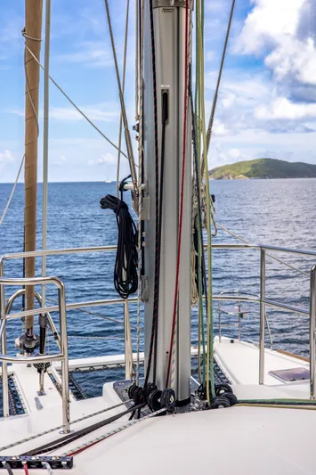 Cascadia 2 Yacht Photos Pics Lagoon 560 sailboat deck view, 2012 model, with ocean and island backdrop.