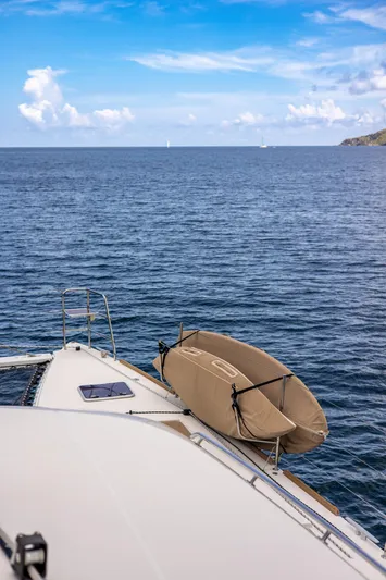 Cascadia 2 Yacht Photos Pics Lagoon 560 yacht on open sea, 2012 model, with clear blue sky and calm waters.