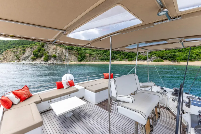 Cascadia 2 Yacht Photos Pics Luxurious 2012 Lagoon 560 yacht interior with scenic ocean view and comfortable seating.