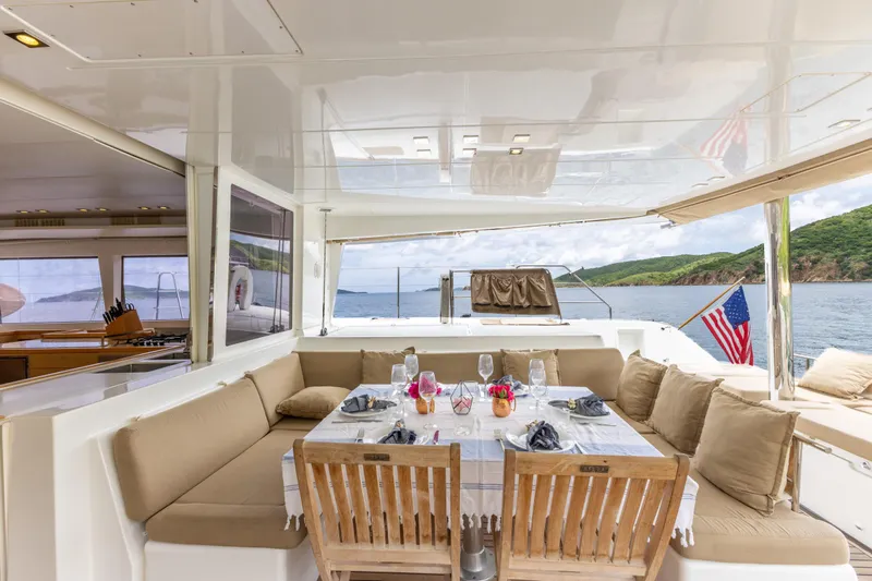 Cascadia 2 Yacht Photos Pics Luxurious Lagoon 560 yacht interior with elegant dining setup, 2012 model, ocean view.