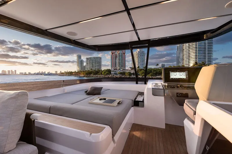  Yacht Photos Pics Manufacturer Provided Image: Luxurious 2026 Ferretti Yachts 860 interior with city skyline view at sunset.