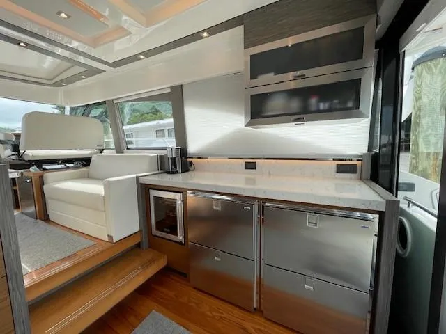 Nexlevel Yacht Photos Pics Modern kitchen area in 2019 Tiara Yachts C53 Coupe with stainless steel appliances.
