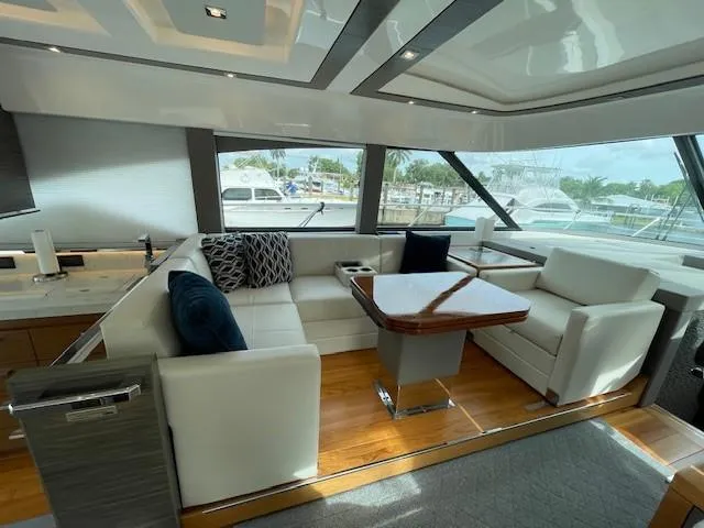 Nexlevel Yacht Photos Pics Luxurious interior of 2019 Tiara Yachts C53 Coupe with white leather seating and modern design.